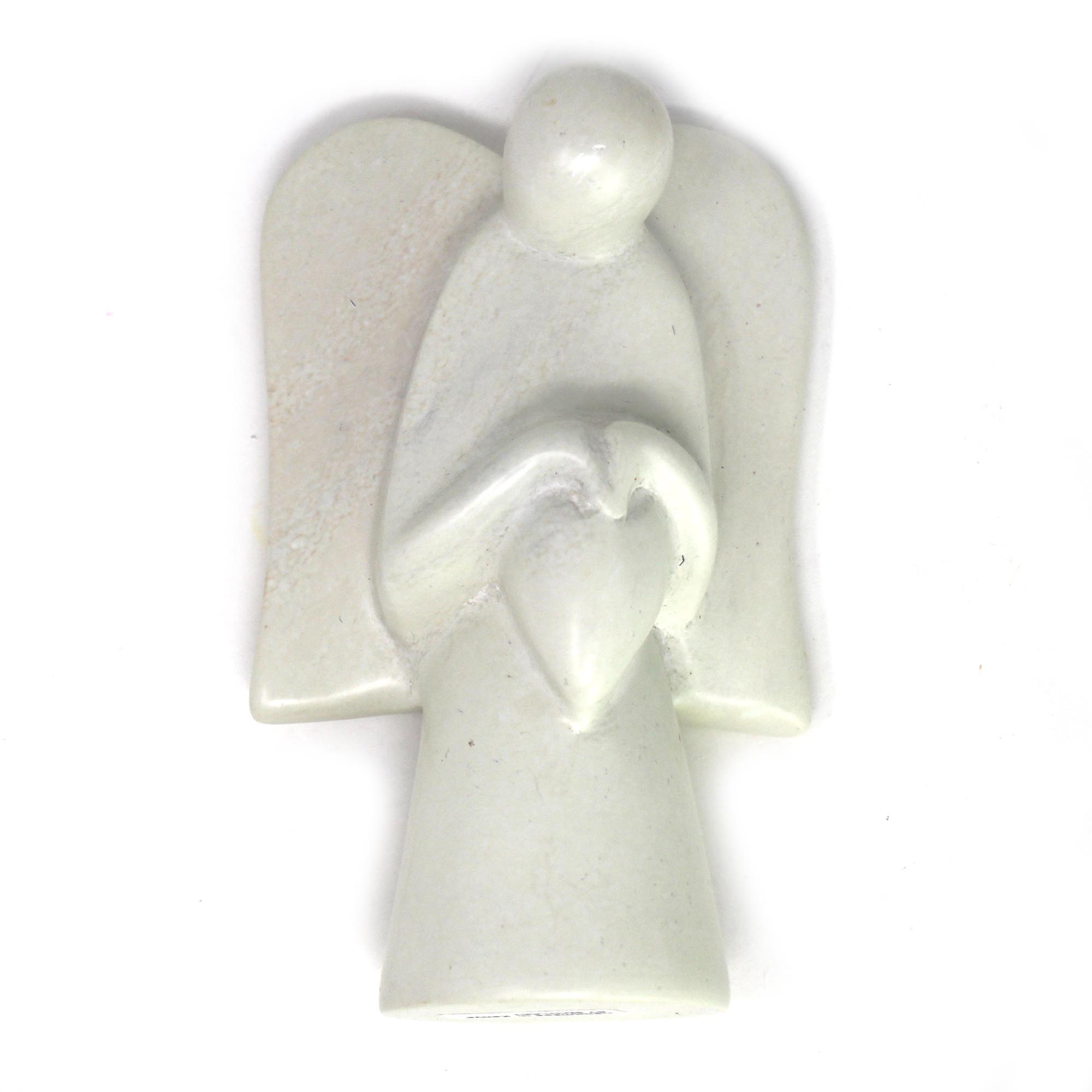 A hand-carved soapstone sculpture of an angel holding a heart, with a satiny finish, in shades of cream, pink, gray, and earthy gold