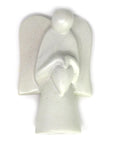 A hand-carved soapstone sculpture of an angel holding a heart, with a satiny finish, in shades of cream, pink, gray, and earthy gold