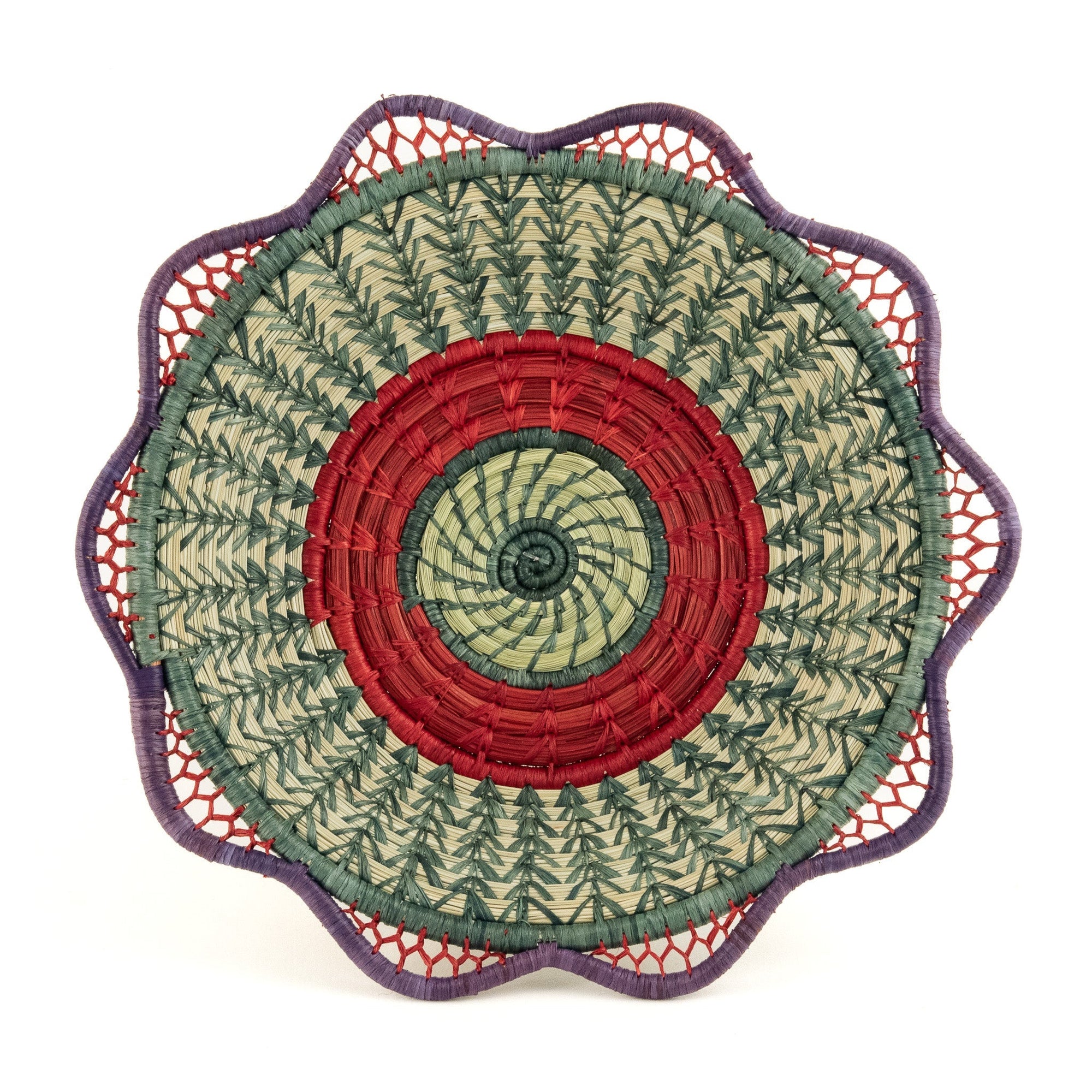 Decorative basket with a red, green, and purple circle pattern on a white background