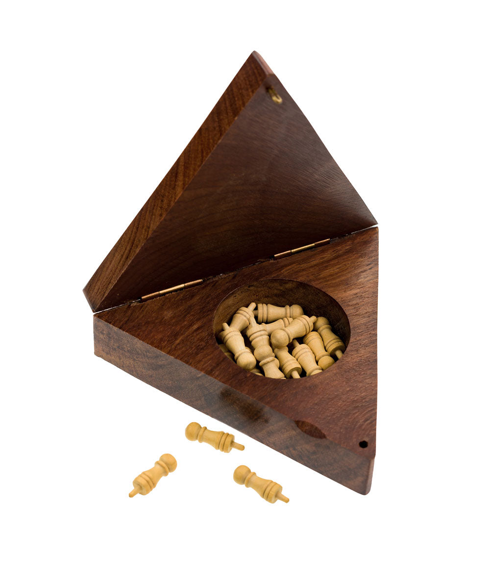 The inside of a triangle solitaire peg board game with the pegs inside.