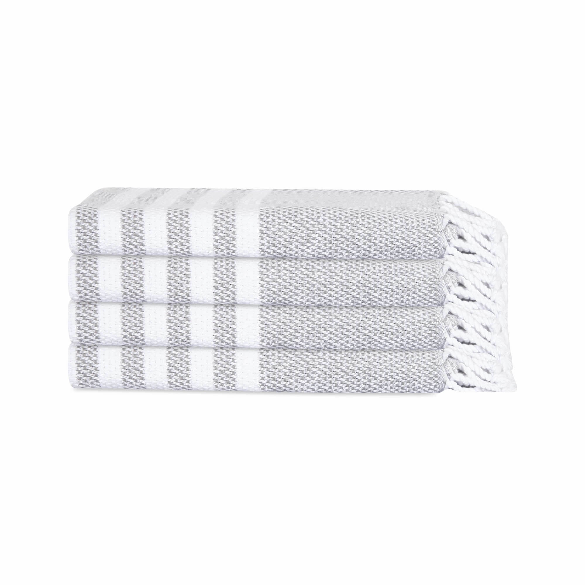 Stack of white towels with gray stripes on a white background