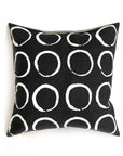 Black pillow with white circular pattern on a white background