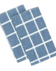 Two terry kitchen towels in blue and ecru colors with a grid pattern