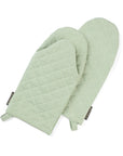 A pair of green oven mitts made from upcycled cotton, displayed against a white background