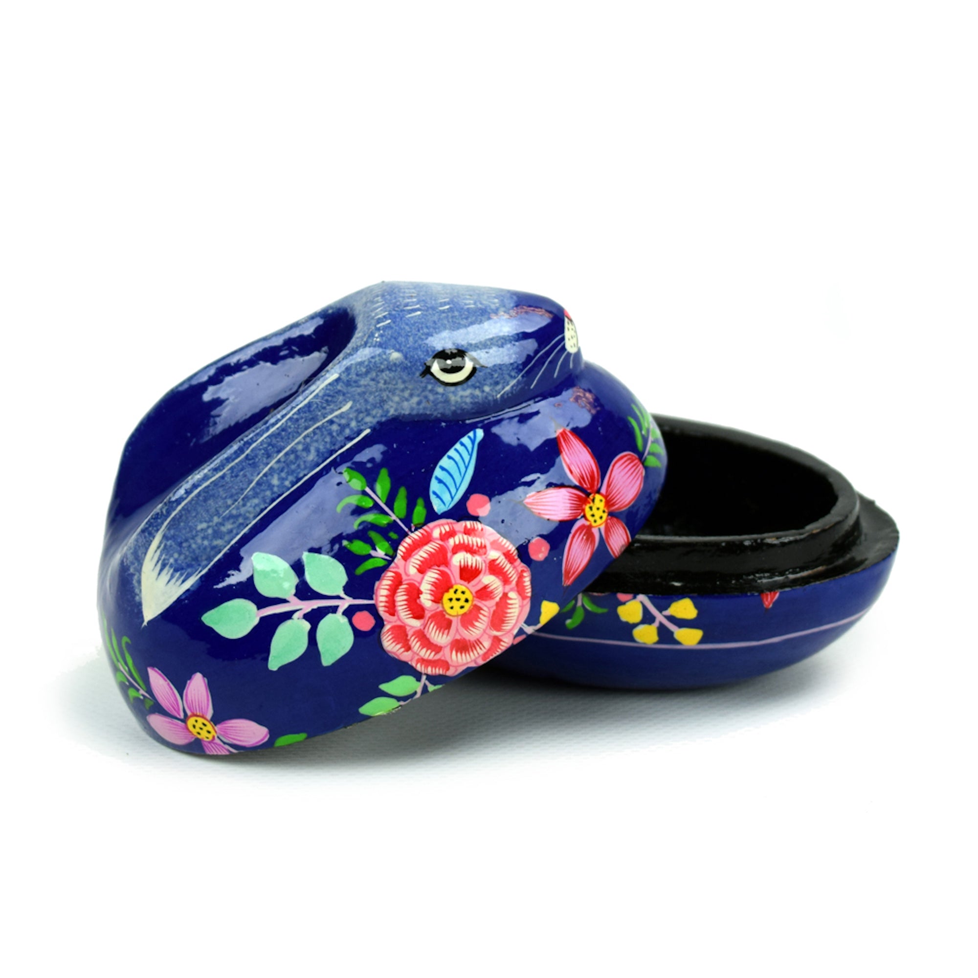 A decorative blue papier-mâché bunny box with hand-painted floral patterns, open lid showing the interior.