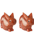 A pair of brown soapstone carved bunny figurines with etched details