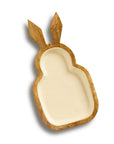 A beige-colored bunny-shaped serving tray made of mango wood with a cream-colored inlay