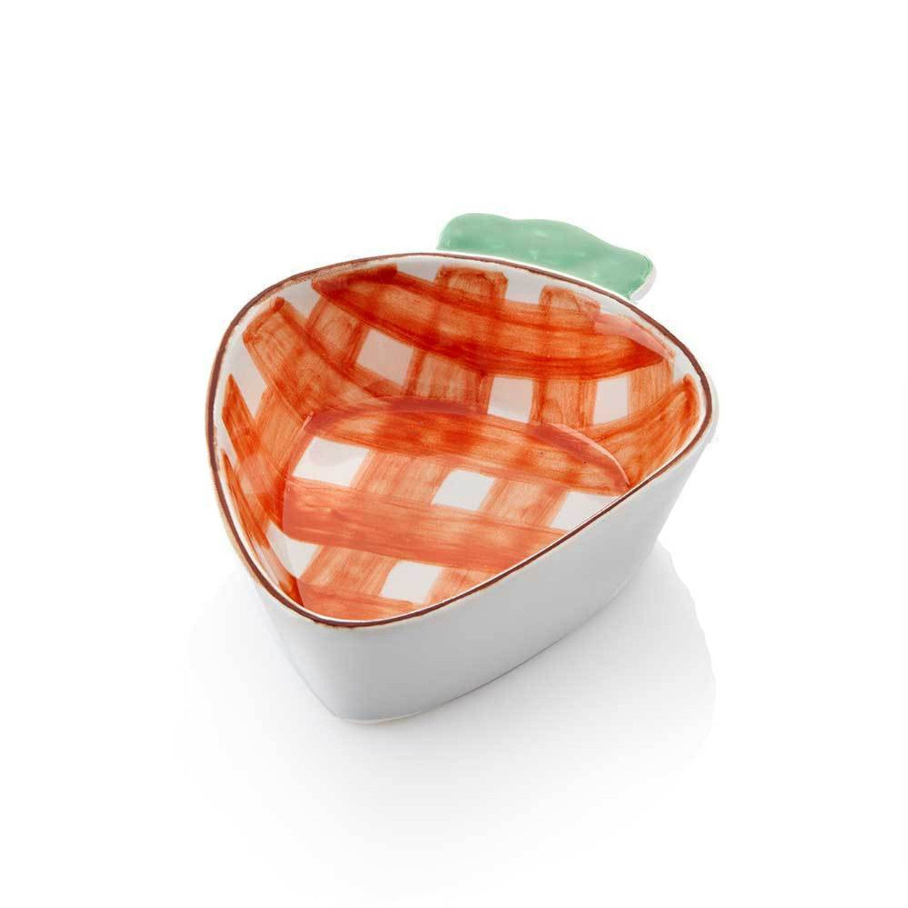 A ceramic serving dish shaped like a carrot with a hand-painted orange plaid pattern and green top.