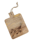 A small wooden serving board with a laser-etched bird and branch design, featuring a jute hanging loop