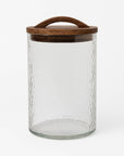 Clear glass jar with a wooden lid on a white background