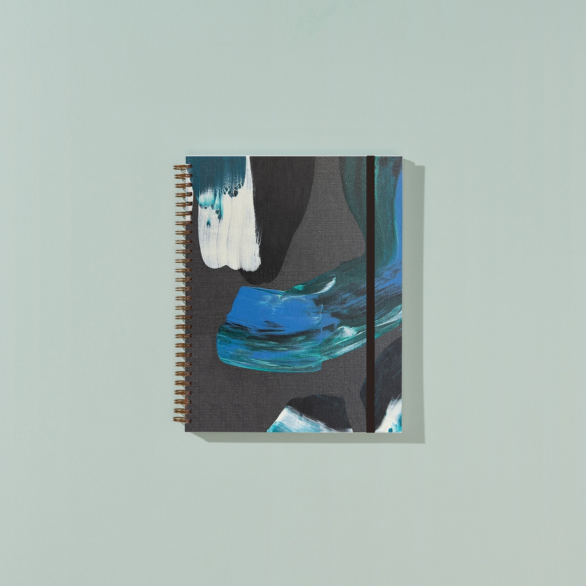 Notebook with abstract design on a light gray background