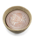 A handwoven terracotta bread basket with a peace dove design bread warmer stone inside