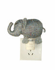 Decorative elephant night light on a white background