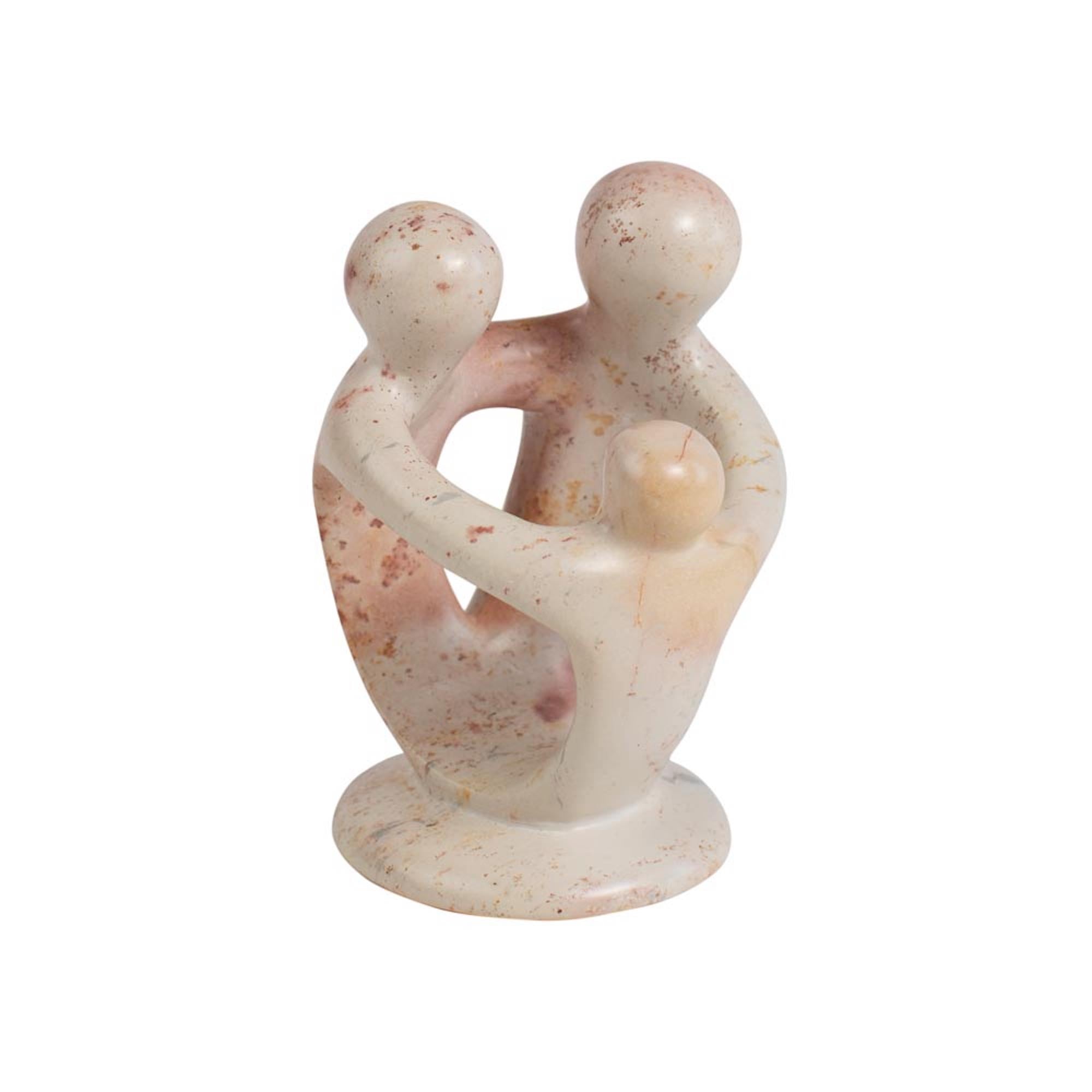 A handcrafted Kisii stone sculpture depicting a family with two adults and a child.