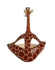 The back of a giraffe-shaped trinket bowl on a white background