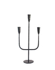 Black metal candelabra with three candle holders on a white background
