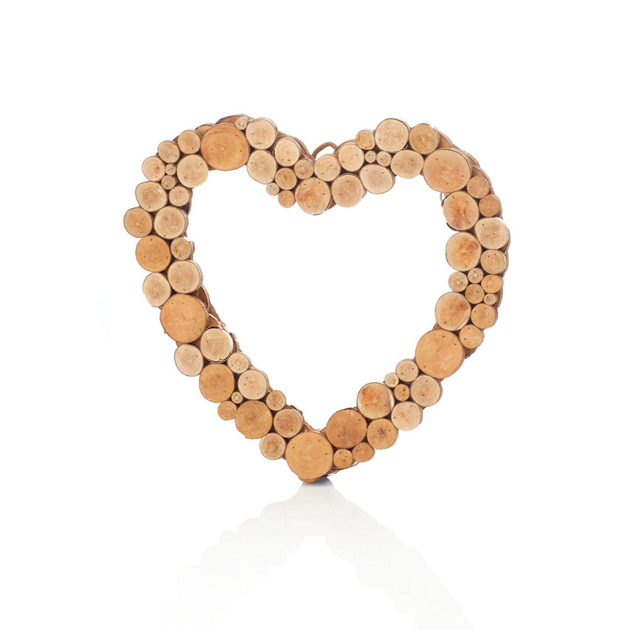 A heart-shaped wreath made from coral tree wood, with a vine frame and cross sections of branches