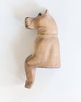 Wooden hippo figurine on a white background
