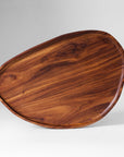 An oval-shaped, brown wooden tray with a smooth finish, displayed against a neutral background