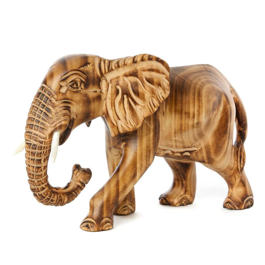 A sculpture of a jacaranda wood elephant with burned contours and cow bone tusks, unpainted and whimsical in style