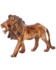 A wooden sculpture of a lion displayed against a white background