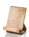 Handcarved wooden recipe stand with mandala design, etched with white patterns on a wooden background, featuring a hinged, adjustable back stand and a charger port opening