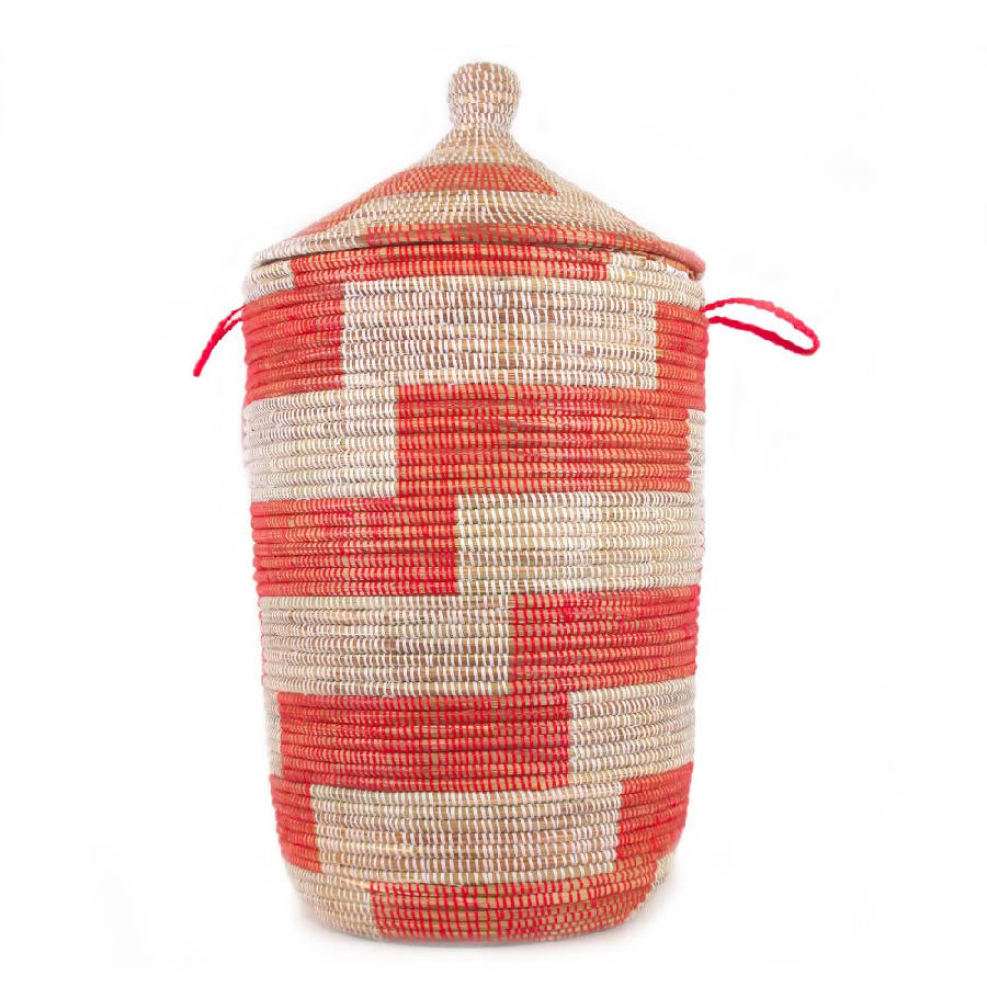 A tall, cylindrical, red and white striped storage basket with a woven design, featuring as a laundry hamper or storage solution.