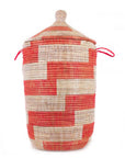 A tall, cylindrical, red and white striped storage basket with a woven design, featuring as a laundry hamper or storage solution.