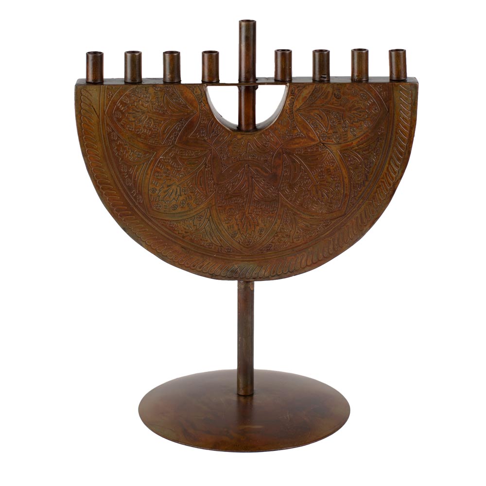 Iron Menorah with intricate carvings on a white background