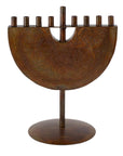 Iron Menorah with intricate carvings on a white background