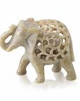 A small sculpture of a double-carved elephant made of gorara stone, with a raised trunk, representing good luck