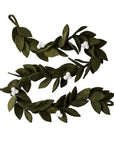 Wool green mistletoe design garland with white felt berries displayed against a white background