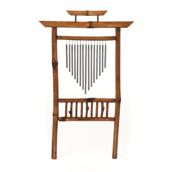 A bamboo garden wind chime with aluminum chimes, hanging from a wooden structure, with a pagoda-inspired design