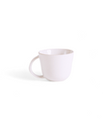 A single matte white stoneware mug with a handle, displayed against a white background