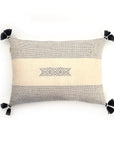 Decorative beige and black pillow cover displayed against a white background