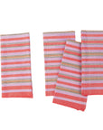 A set of four striped cotton napkins in pink and blue, handwoven and laid out flat