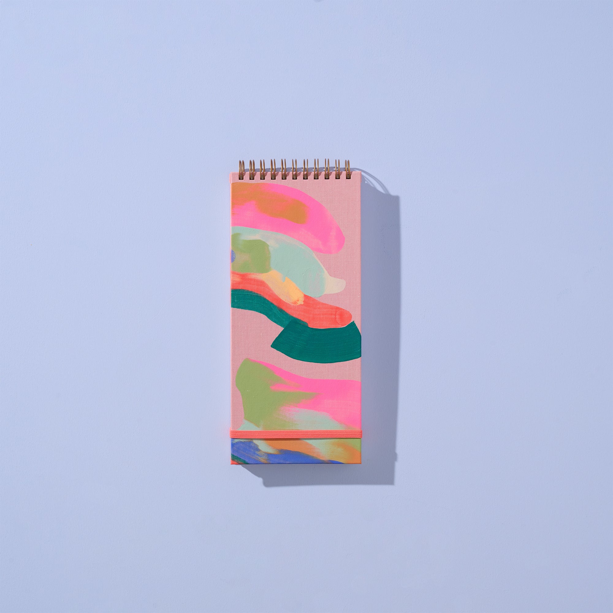 Notebook with colorful abstract design on a light blue background