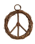 A round peace symbol wreath made from takip-asin wood and galtang vine, with a loop for hanging at the top