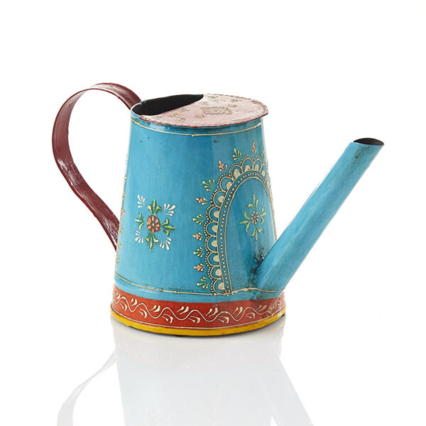 A hand-painted iron watering can with floral and mehndi-style motifs, predominantly blue with red and yellow accents