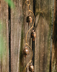 Decorative hanging bells on a wooden surface