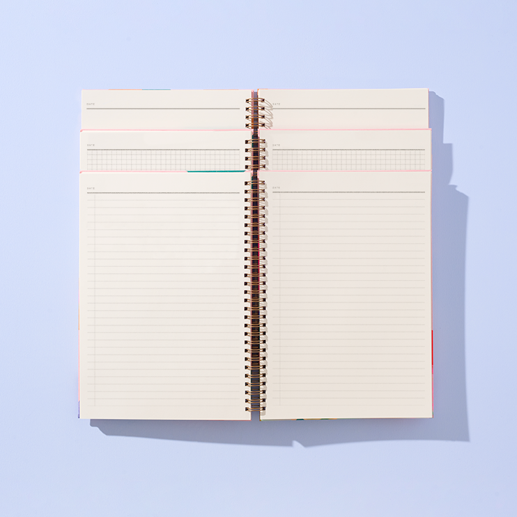 Open notebook with lined pages on a light blue background