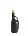 A black stoneware olive oil canard bottle with a cork stopper, inspired by the shape of a duck