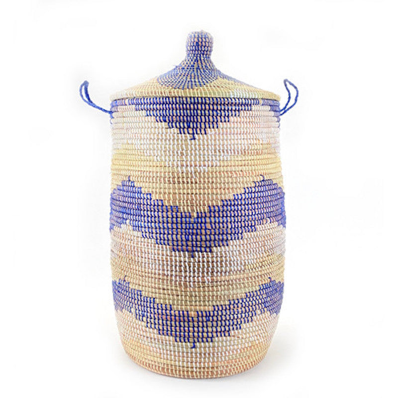 A large hamper basket with a lid, featuring a blue and natural chevron pattern, made from woven material.