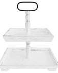A two tiered rectangular wooden serving tray with a white finish and a central handle.