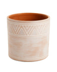 Ceramic planter with geometric pattern on a white background