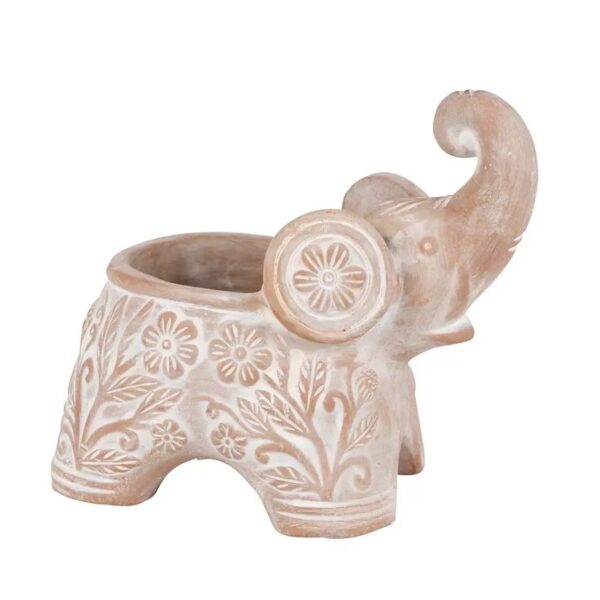 A terracotta planter in the shape of an elephant, with a whitewashed finish and floral details