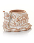 A whimsical terracotta planter designed to resemble a snail, with a white and beige color finish, containing a drainage hole.
