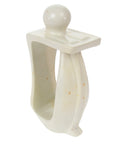 Hand-carved soapstone sculpture of a person in a thoughtful pose with a bookend feature on one side