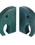 A pair of teal colored elephant bookends made from soapstone, with a smooth and shiny finish