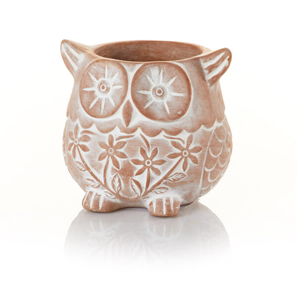A whitewashed terracotta owl-shaped planter with a drainage hole at the bottom